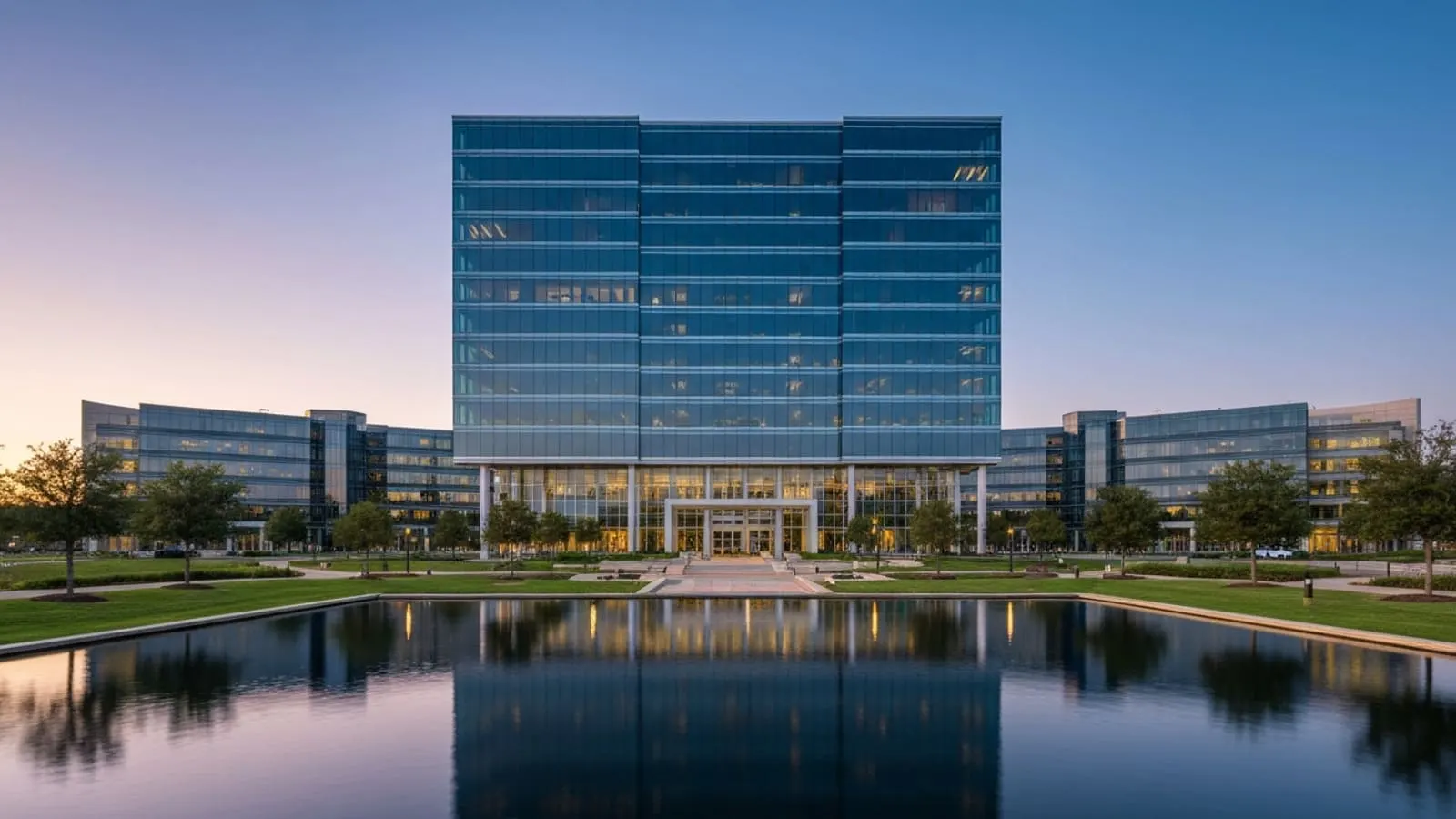 Plano Legacy West skyline at sunset with modern corporate towers and the Toyota North America HQ visible